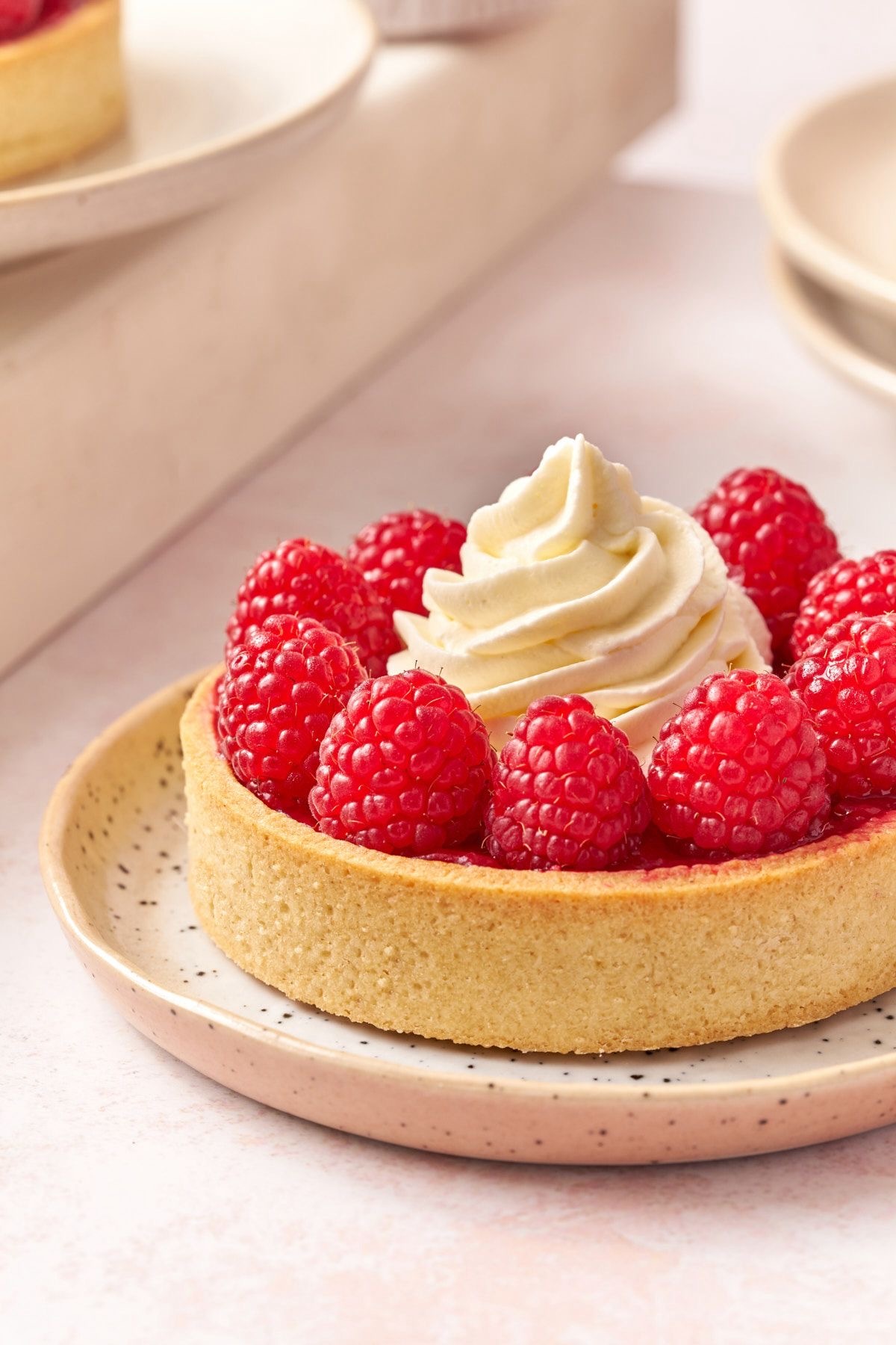 Raspberry Tart — fresh raspberries on vanilla cream in a golden shell