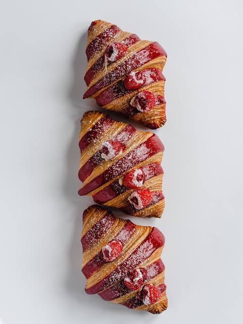 Raspberry Croissant — bright raspberry coulis inside flaky butter dough